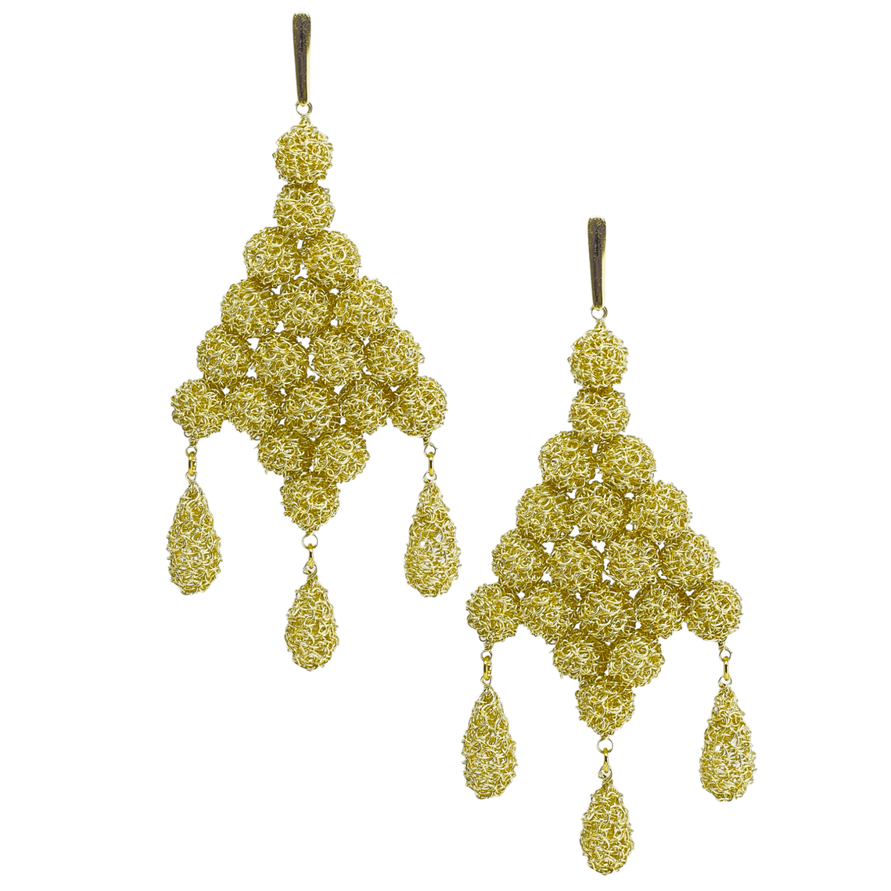 woman handmade earrings in golden wire