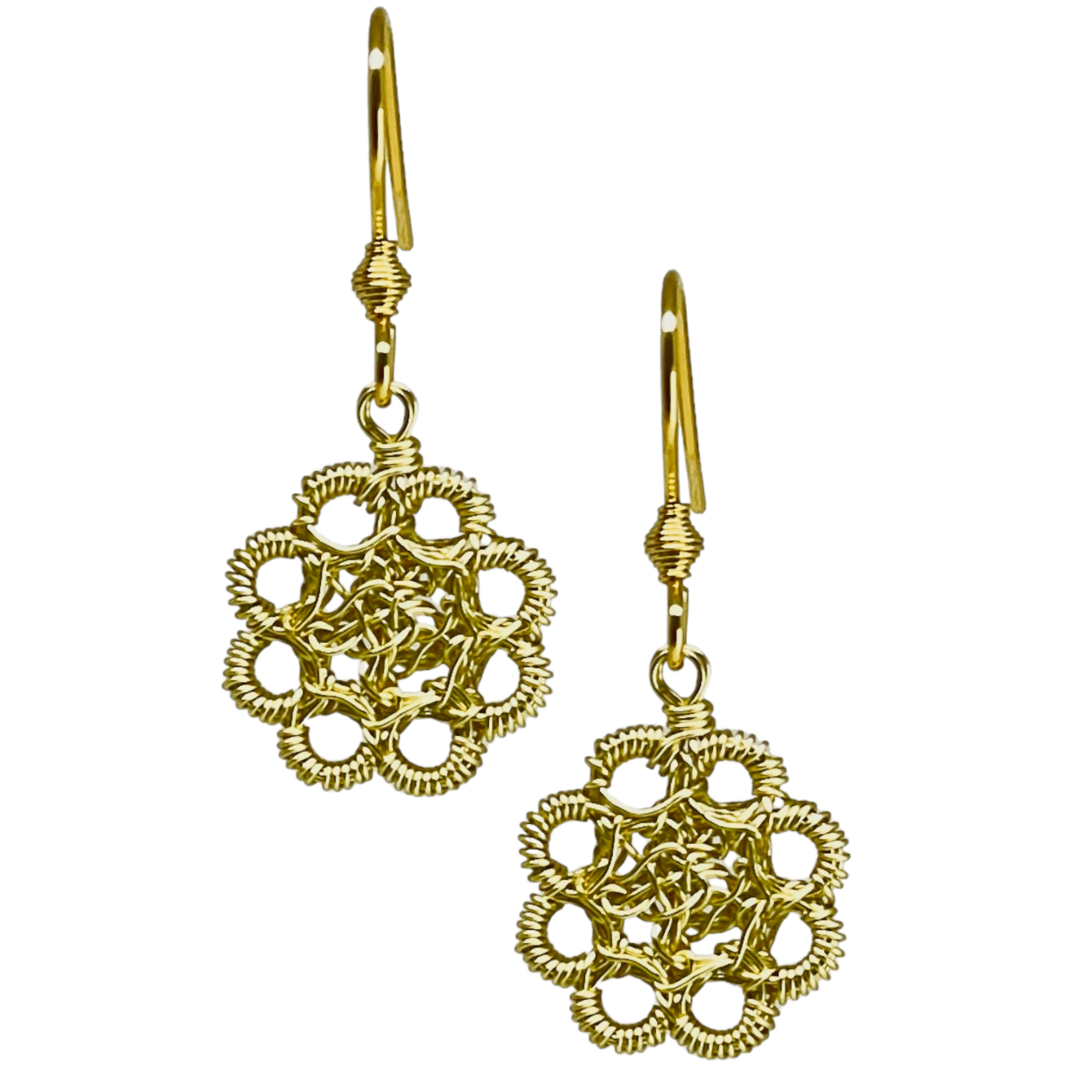 woman handmade earrings in golden wire