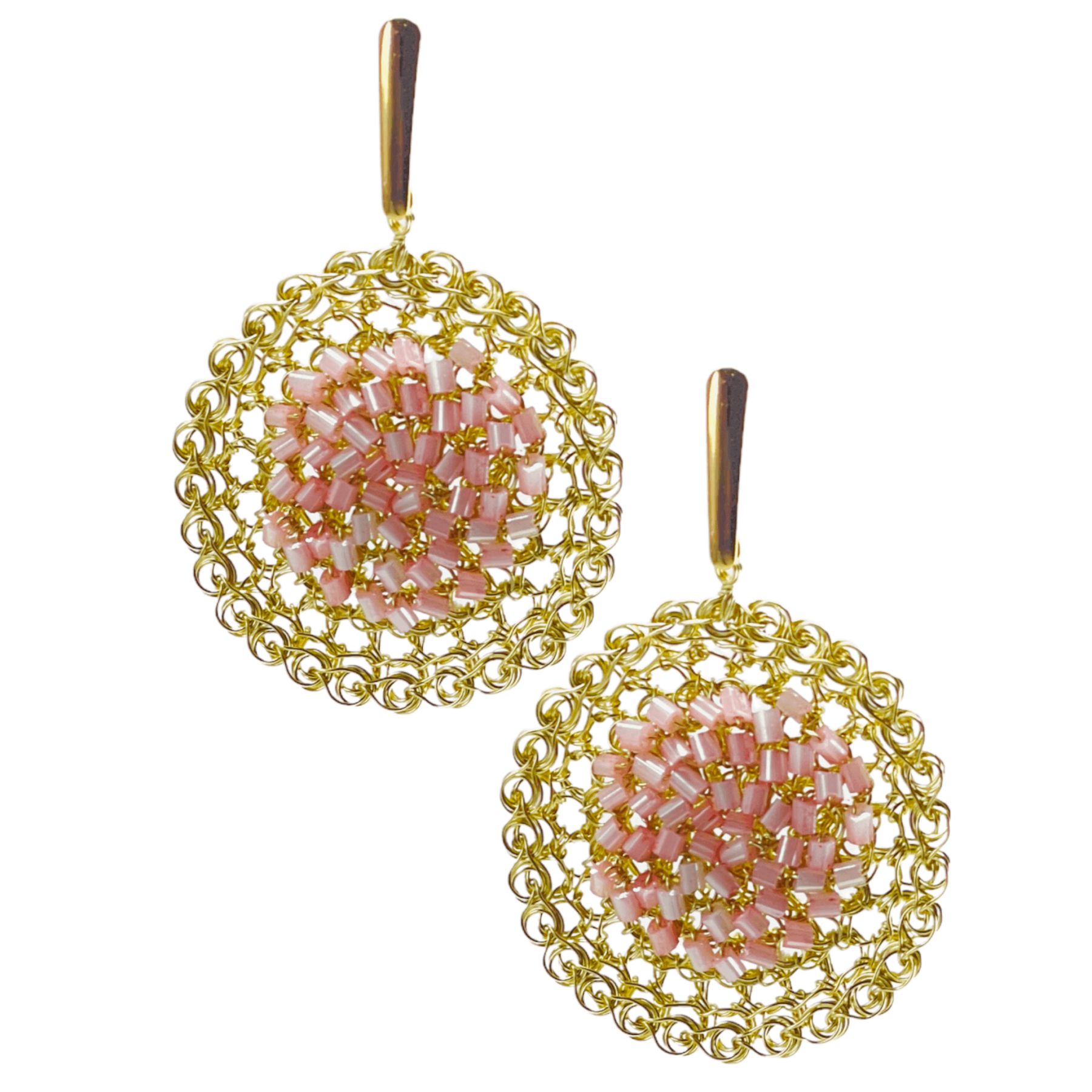 woman handmade earrings in golden wire