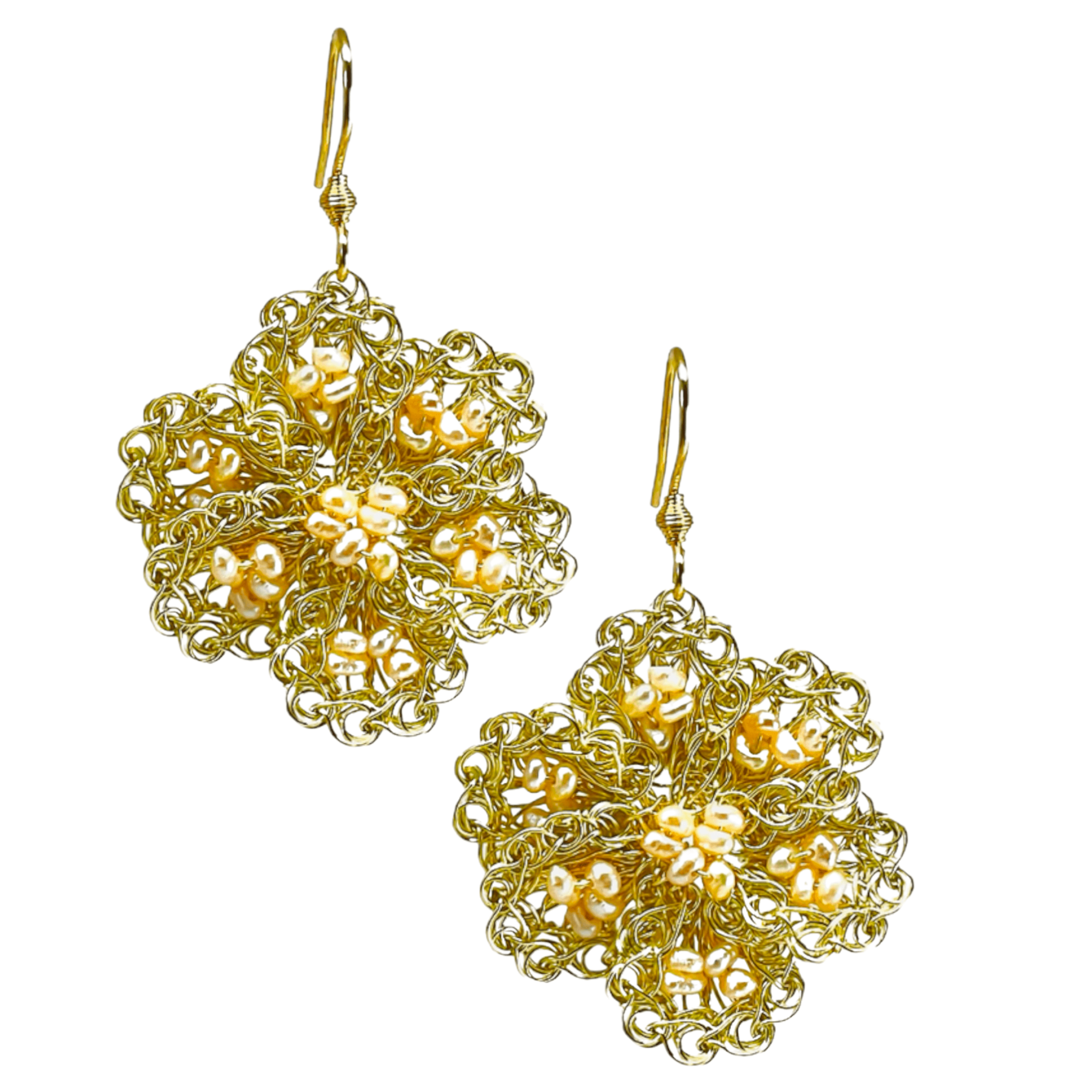woman handmade earrings in golden wire