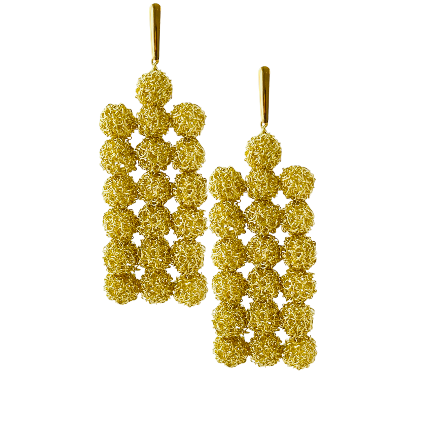 woman handmade earrings in golden wire