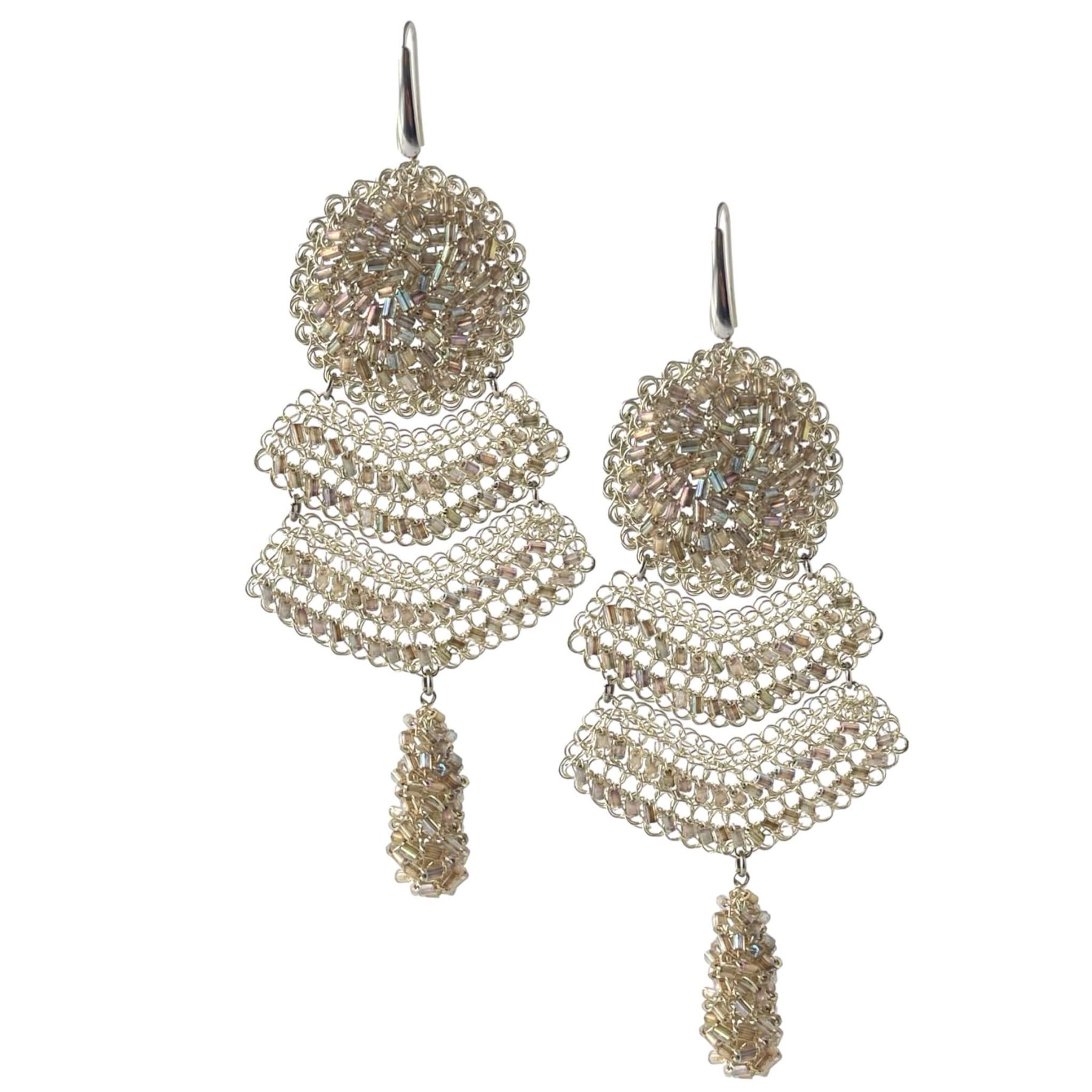 woman handmade earrings in silver wire