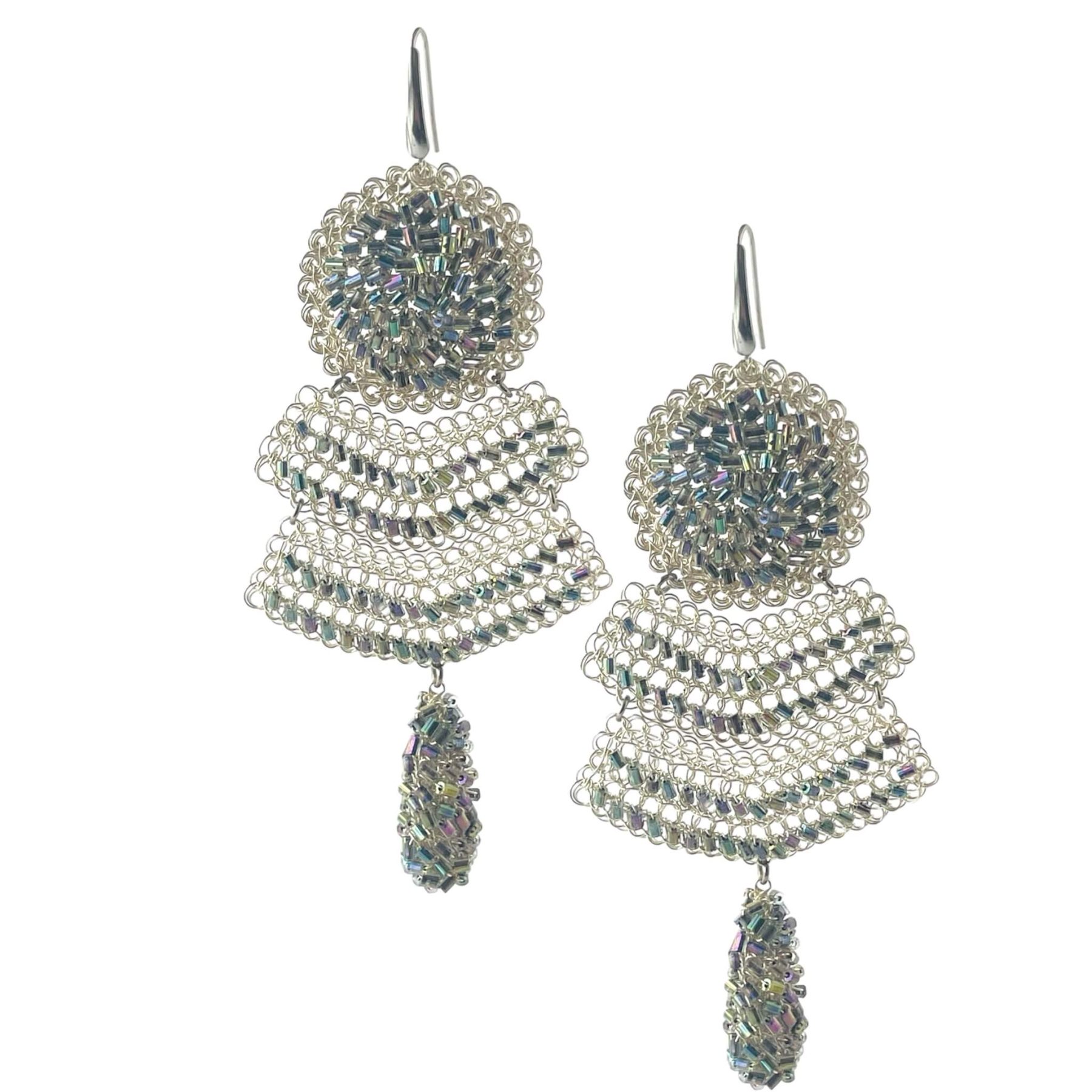 woman handmade earrings in silver wire