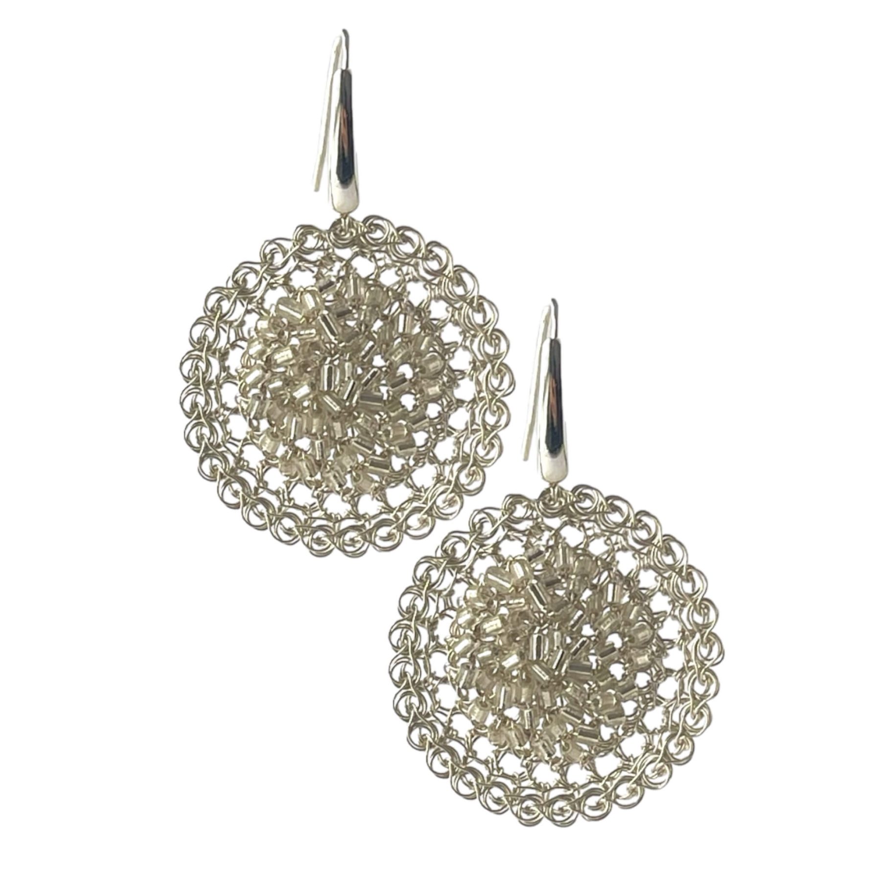 woman handmade earring in silver wire