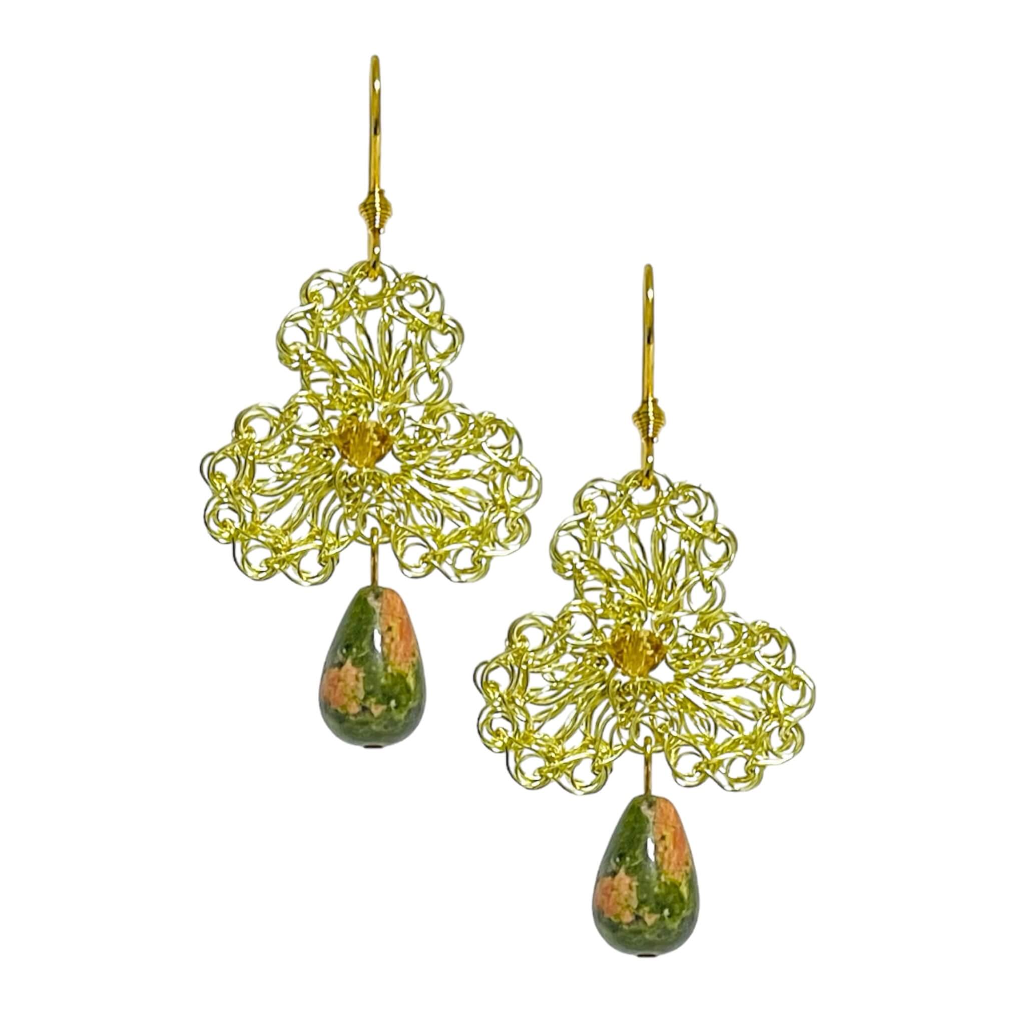 woman handmade earrings in golden wire woman handmade earrings in golden wire